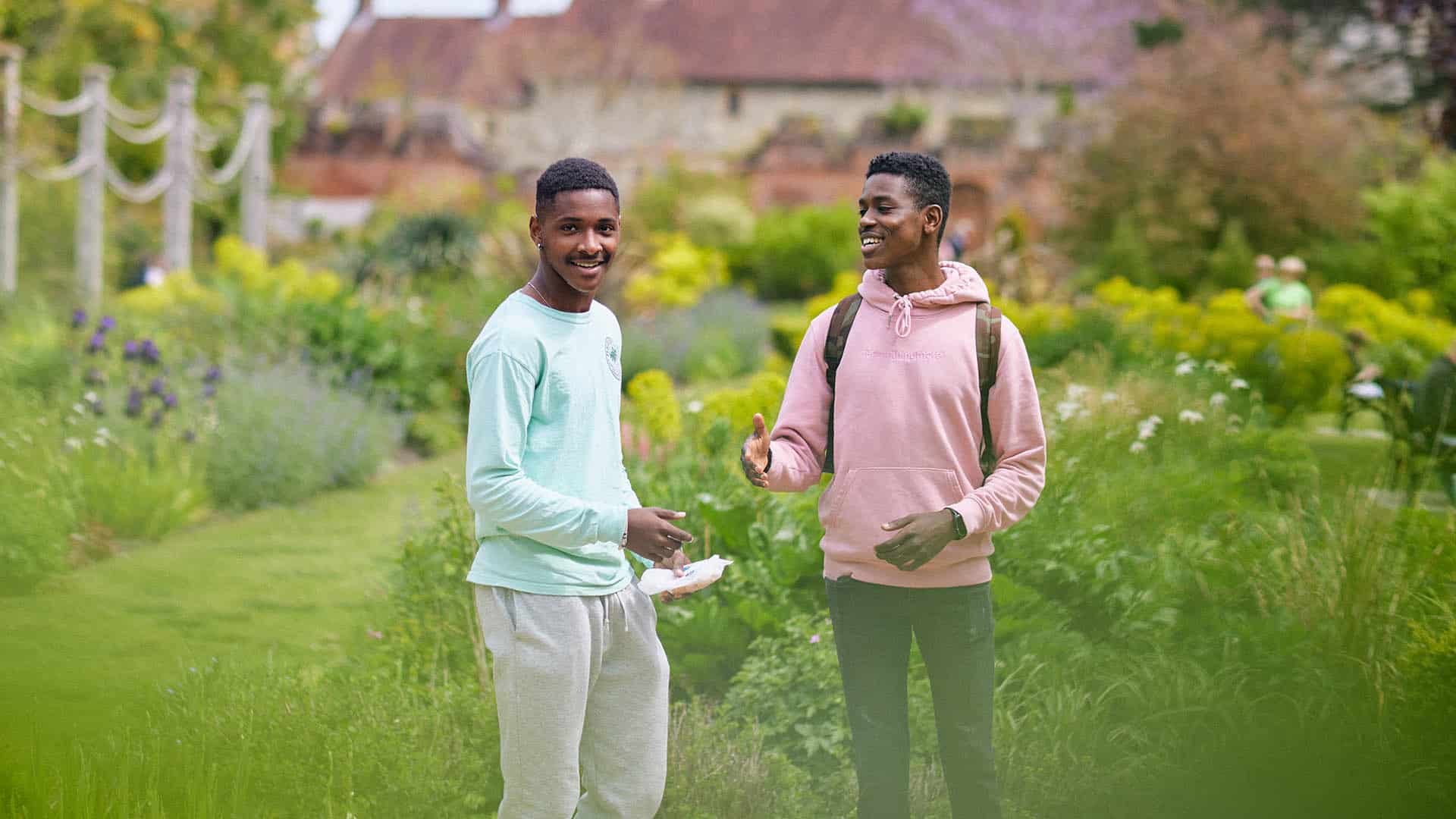 21 Students Chichester Park 1920 X 1080 2 two students laughing in local park